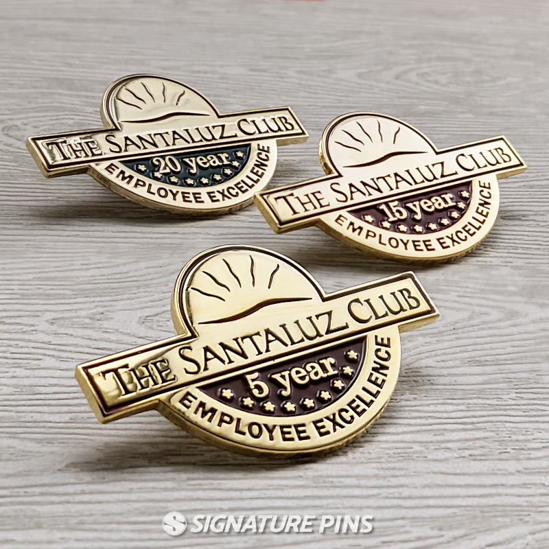 The Santaluz Club pins by signature pins